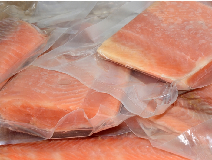 frozen salmon in vacuum-sealed plastic